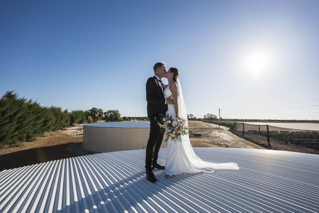 Bride and groom on a water tower