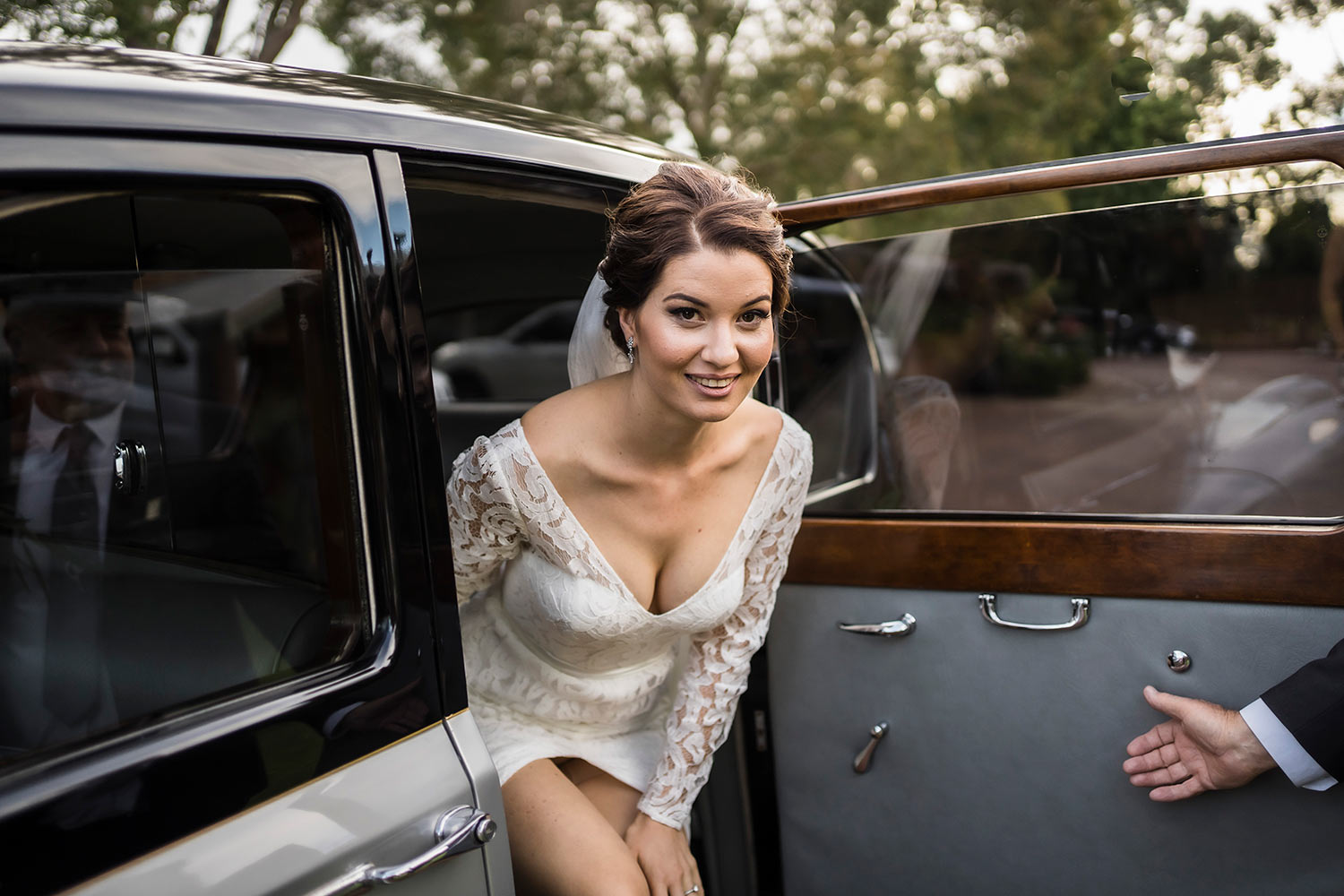 bride getting out of wedding car Sittella Winery