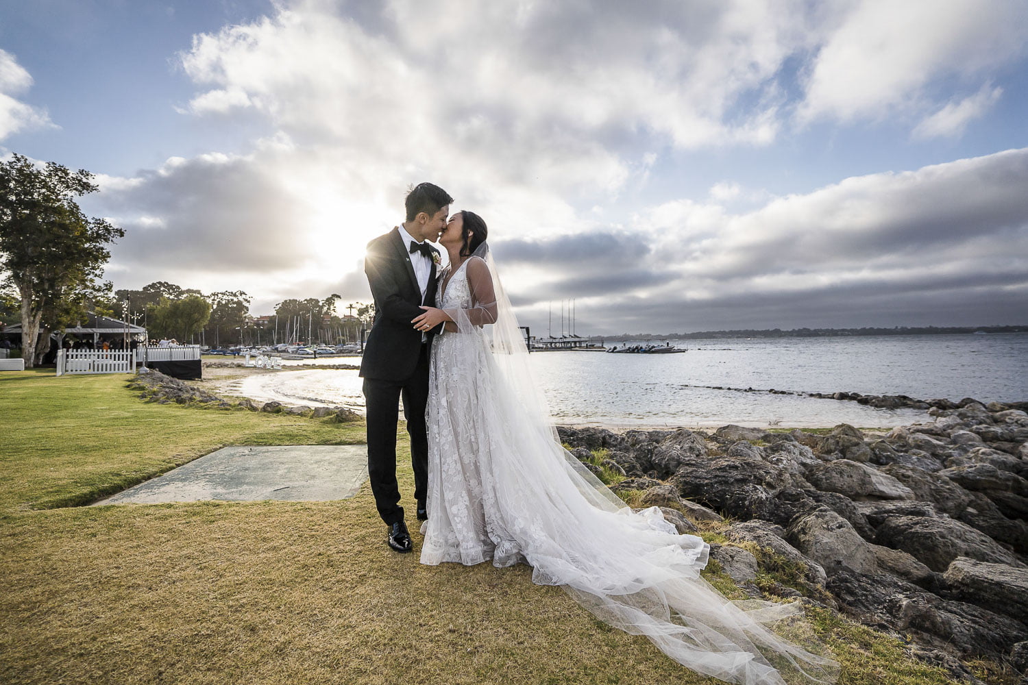 South Perth yacht club kissing bride and groom